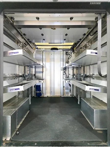 Shelving and lower storage compartments running the length of a box truck body