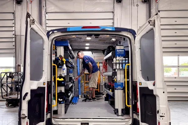 Van with Sortimo shelving being fitted in the shop