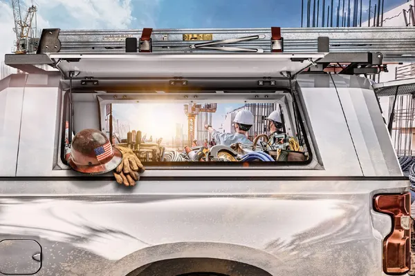 Open SmartCap side window showing tools and hard hats inside the bed