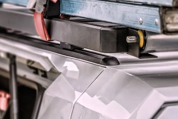 Ladder rack clamped to the universal roof rails on a SmartCap