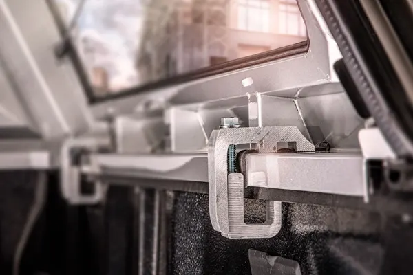 SmartCap mounting clamp gripping the pickup bed rail