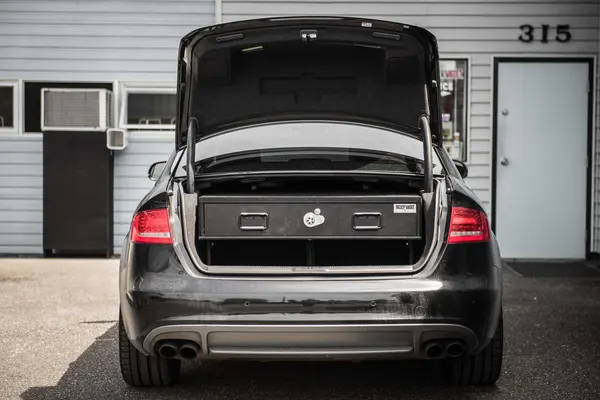Elevated single-drawer TruckVault in the trunk of a black Audi sedan