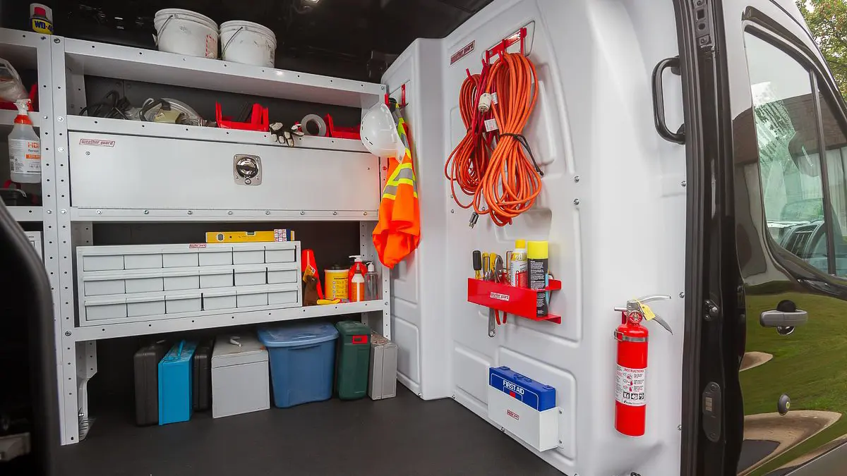 Holman partition and shelving inside a work van, seen through the side door