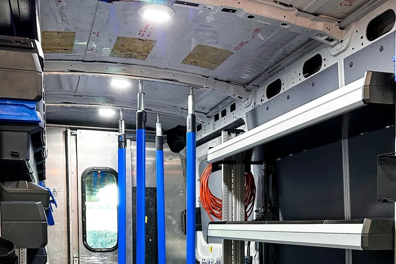 Upfitted van ceiling with LED cargo lighting