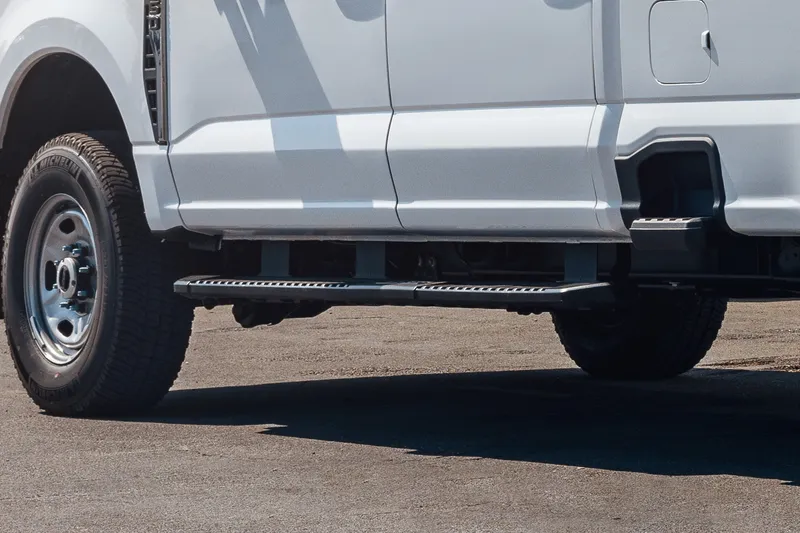 Running boards installed on a work pickup