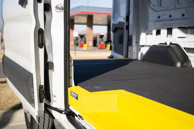 Non-slip step installed at a work van side door