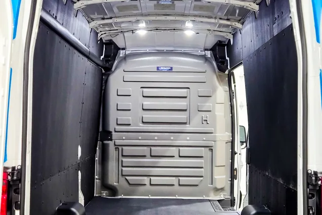 Cargo van interior with full wall liner panels and protective flooring